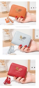 Short vegan leather wallets with metal leaf decor, zipper tassel, and cute rabbit pendant