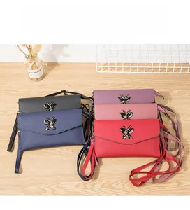 Detailed view of fashionable textured PU leather wallets in five colors with butterfly buckles