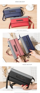 Detail of four colorful crossbody phone bags with striped flap and metal chain ornament