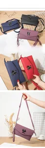 Close-up of litchi leather phone bags with butterfly hardware in four elegant colors