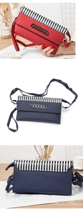 Detail view of striped phone bag with metallic chain and leather texture finish