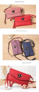 Detail view of leather crossbody bags with metal butterfly buckle and detachable straps