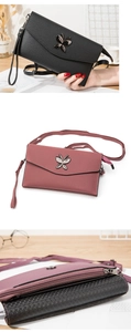 Detail of crossbody bag with butterfly metal hardware and litchi texture faux leather