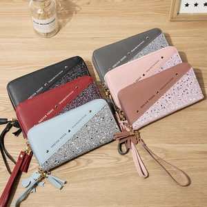 Women's long zipper wallet with diagonal patchwork glitter design and tassel strap