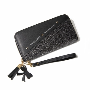 Long black zipper wallet for women with sequins, tassels, and Forever Young lettering