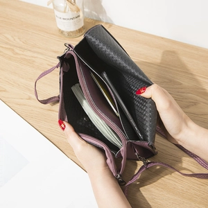 Dual-tone purple crossbody phone bag with butterfly hardware and multi-layer storage space