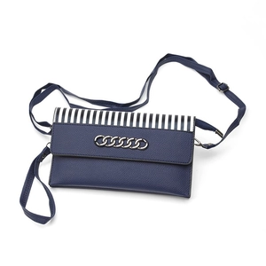 Dark blue pebbled leather crossbody bag with striped flap and silver chain accent