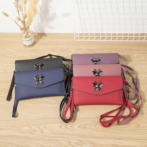 Crossbody phone bags in five colors with butterfly hardware and litchi texture