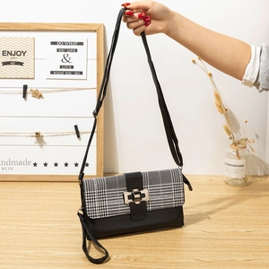 Modern checkered long wallet with black leather contrast and elegant matte metal clasp