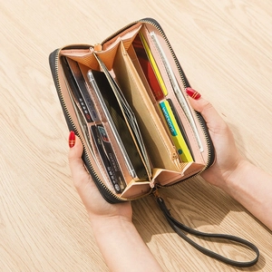 Black long zip wallet for women featuring colorful interior slots and large capacity