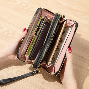 Black long wallet with double zippers, showing spacious pink multi-layer interior for phone