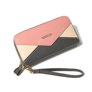 Women's long double zipper wallet with pink and beige geometric patchwork and wristlet