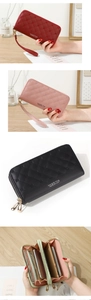 Detail view of large capacity quilted wallets with dual zippers and crown decoration