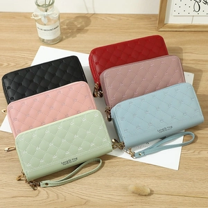 Quilted faux leather long phone wallet with crown embroidery and wristlet strap