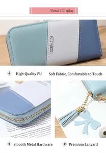 Macro detail of tricolor patchwork leather wallet featuring tassel and smooth zipper closure