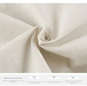 Close-up of cream woven fabric texture and Class A safety standards for kids' clothing