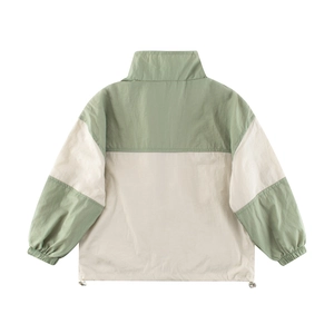 Detail of color-block windbreaker with adjustable drawstring hem and elastic cuffs