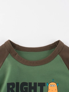 Kids long-sleeved raglan t-shirt featuring forest green sleeves and a cartoon alien print