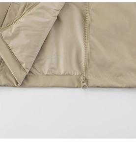 Detail view of khaki toddler jacket showing smooth zipper and neat stitching finish