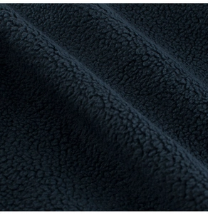 Close-up of warm navy blue polar fleece fabric texture showing soft dense fibers