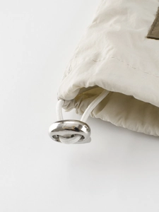 Boy's woven jacket featuring adjustable drawstring and polished silver toggle detail
