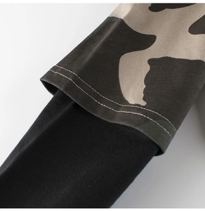 Close-up of boys camouflage long sleeve sweatshirt cuff with faux two-piece design details