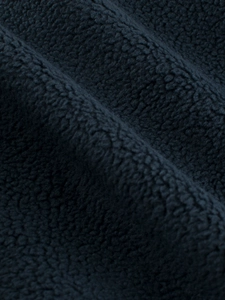 Navy blue fleece sweatshirt fabric texture close-up showing soft warm winter material