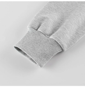 Detail of ribbed cuffs on a light grey fleece sweatshirt for boys and kids