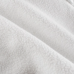 Close-up of soft white fleece fabric texture for cozy boys' sweatshirt material