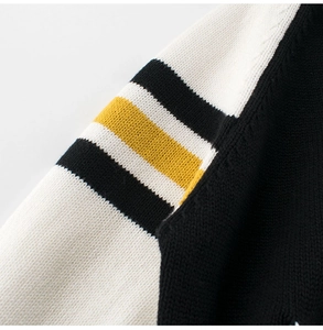 Detailed macro view of high-density knit sleeve with yellow, white and black stripes