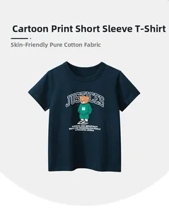 Close-up of boys navy blue cotton T-shirt showing cartoon bear print and soft fabric texture