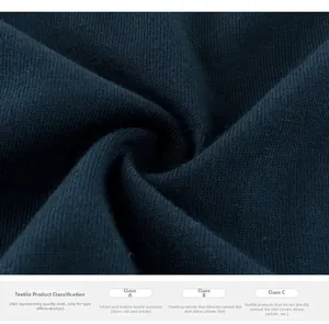 Close-up of navy blue cotton fabric texture with textile safety standards chart