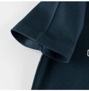Detail of navy blue cotton t-shirt sleeve with high-quality double-needle stitching
