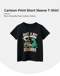 Detail of skin-friendly cotton fabric on a black kids t-shirt with dinosaur print