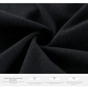 Detail of soft black knitted fabric texture and safety certification info for kids T-shirt