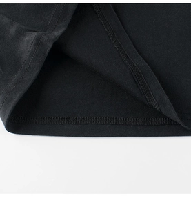 Close-up of black cotton T-shirt hem showing high-quality double-needle stitching detail