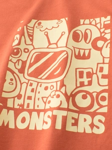 Kids cotton t-shirt in terra cotta featuring white cartoon monster graphic print