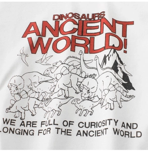 Detailed view of the dinosaur print and hand-drawn patterns on a white cotton T-shirt