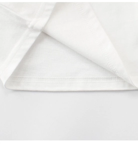 Detailed view of white cotton t-shirt hem featuring professional double-needle stitching