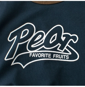 Detail of navy blue t-shirt with brown ribbed collar and white Pear graphic print