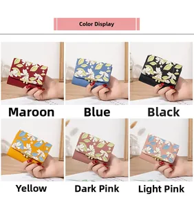 Mini floral flap wallets for women shown in six diverse colors on a wooden surface