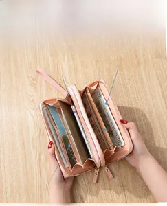 Internal layout of pink dual-zipper clutch with phone slot, card holders and coin pocket