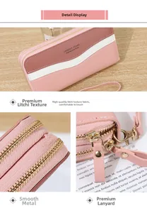 Detail view of pink litchi grain long wallet featuring dual gold zippers and wrist strap