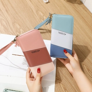 Women's long zip-around wallet with color-block patchwork and a detachable wrist strap
