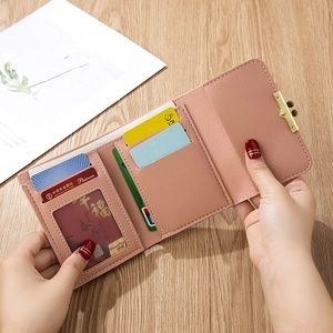Mini light pink tri-fold faux leather wallet with floral hardware and card slots