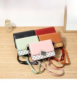 Close-up of stylish PU leather mobile phone crossbody bags in five diverse colors