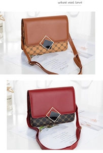 Detail of vintage crossbody bags in brown and red leather with metal buckle and patterns