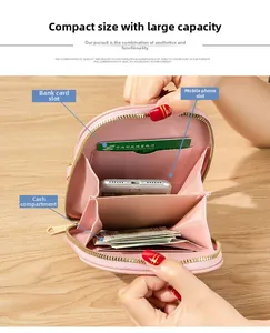 Detail of pink embroidered crossbody phone bag with cards slots and cash compartments
