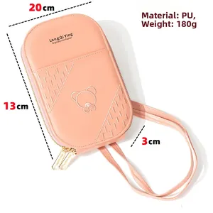 Detail view of pink PU crossbody phone bag with bear embroidery and zip closure