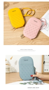 Detail of heart-quilted texture and dual zippers on stylish vertical mobile phone bags
